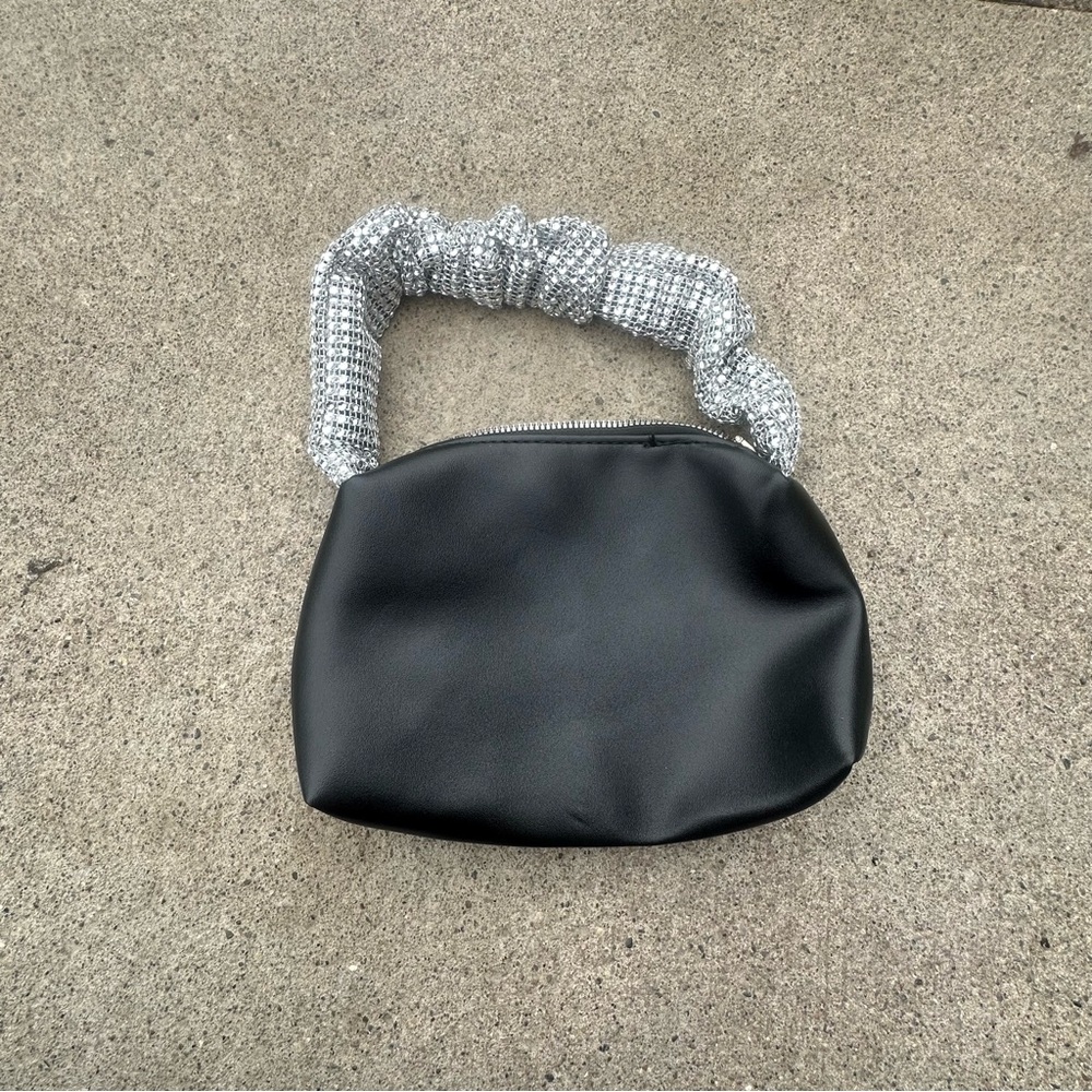 Elegant Black Bag with Silver Handle